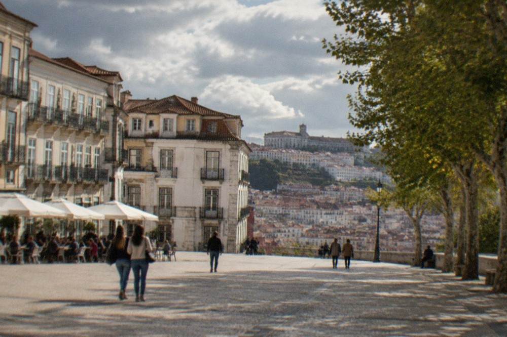The narrow cobbled streets of Coimbra's old town below the university hill