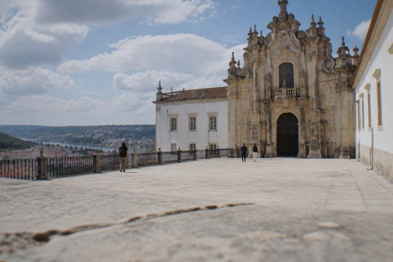 The ornate baroque facade of the University of Coimbra's Royal Palace on the university hill above the city