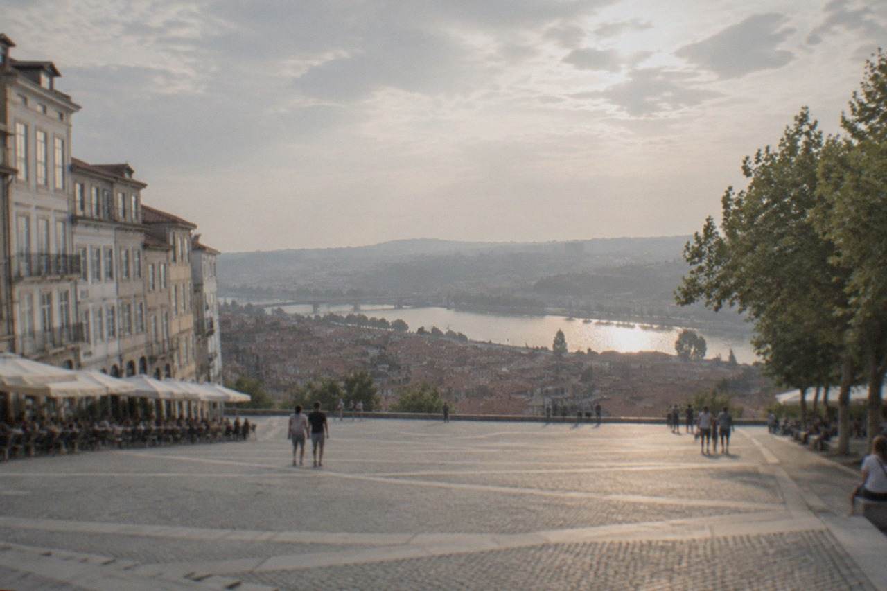 View over the tiled roofs and university hill of Coimbra toward the River Mondego