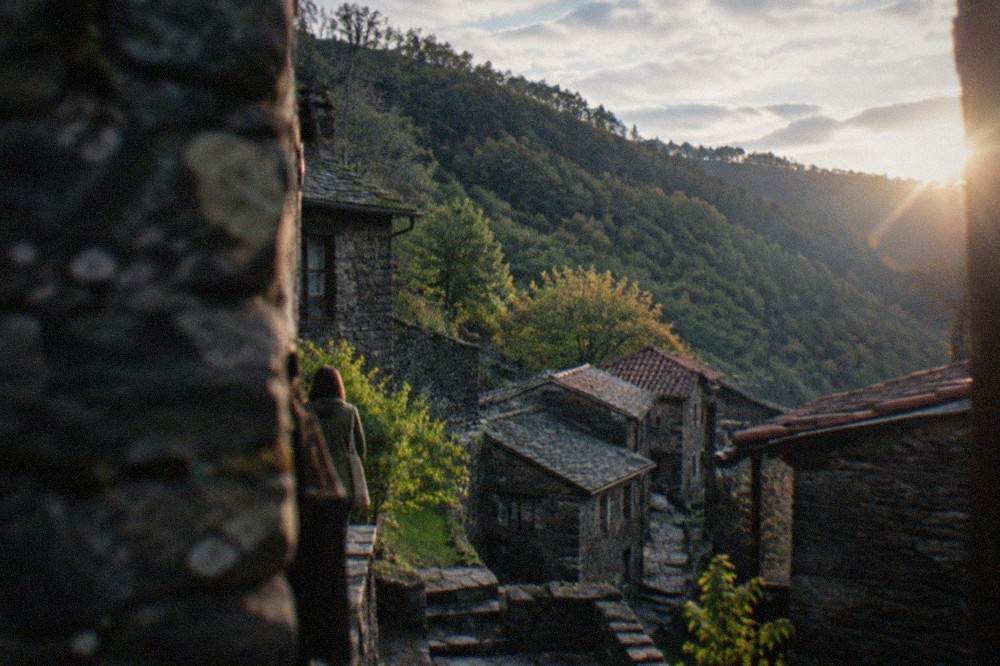 Stone houses of a schist village on the forested slope of the Lousã mountain near Coimbra