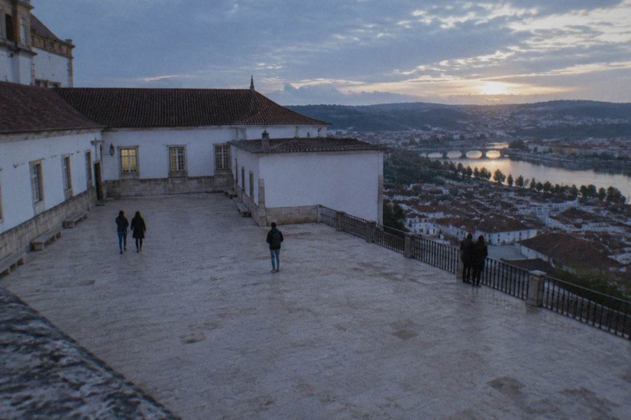 The University of Coimbra buildings on the hill above the River Mondego, seen from the city below