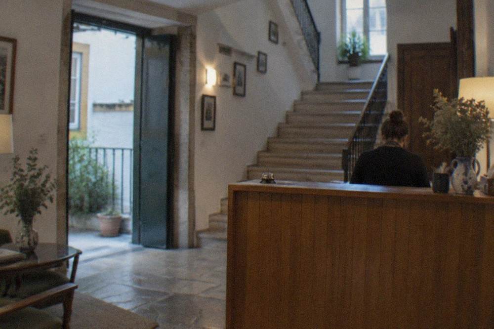 Reception desk of a small guesthouse in central Coimbra, Portugal