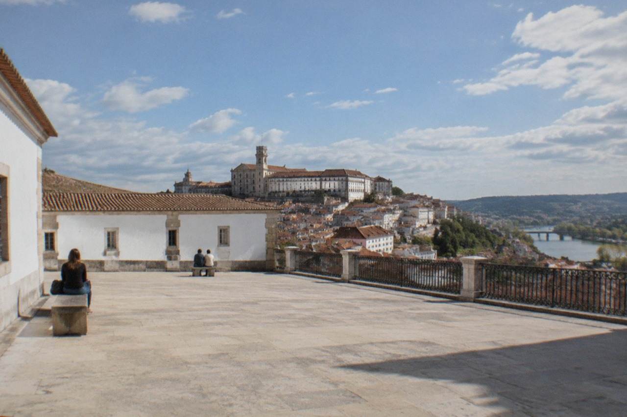 The University of Coimbra buildings seen from the old town below on a bright morning