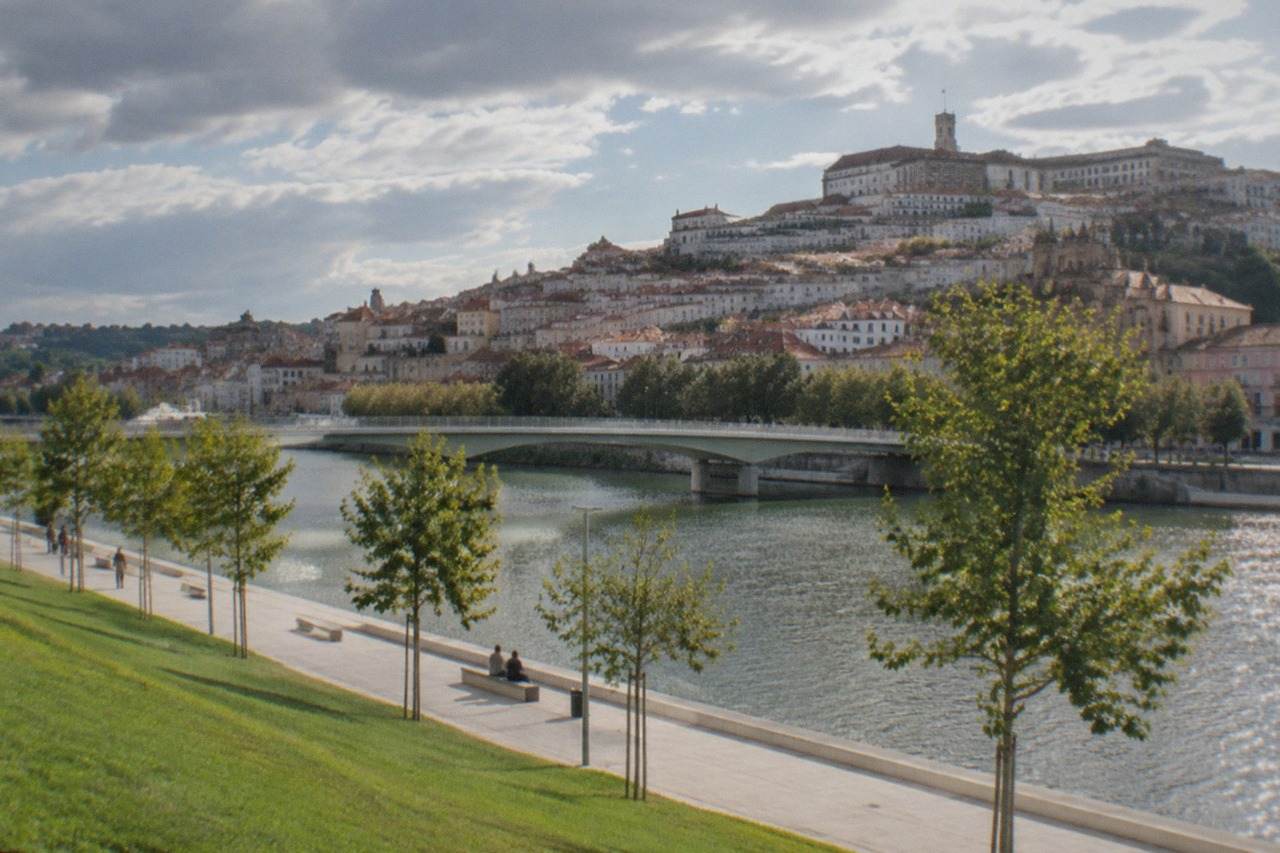 The old town of Coimbra rising above the River Mondego, with the university buildings on the hilltop