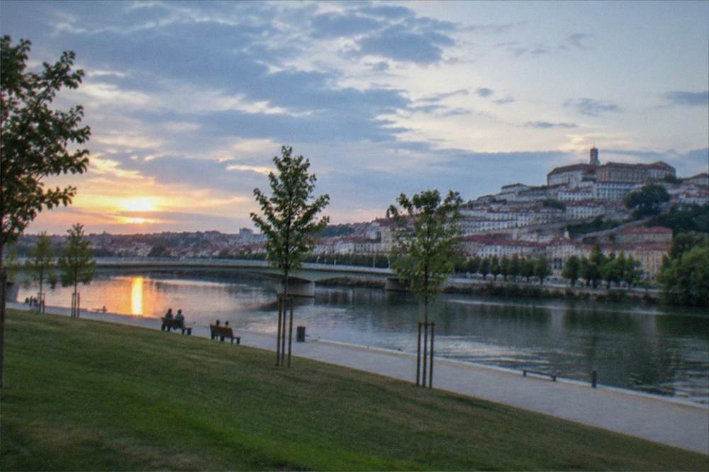 Sunset light over the River Mondego seen from the upper town terraces