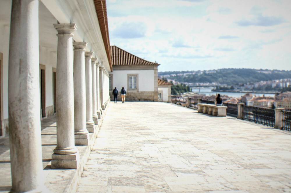 The painted colonnade of the Via Latina along the edge of the university courtyard