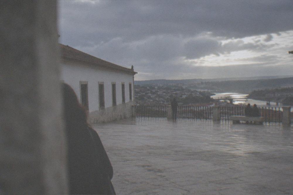 The wide stone terrace of the Paço das Escolas overlooking the River Mondego and the lower town of Coimbra