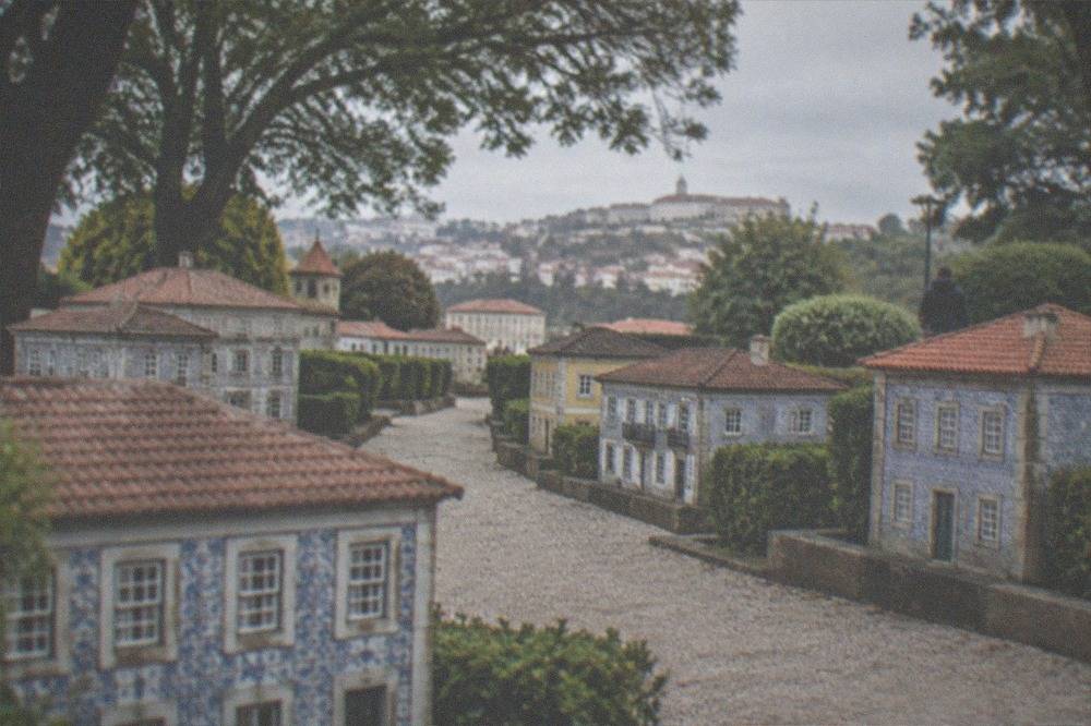 Miniature houses with tiled facades seen from a low child-height angle