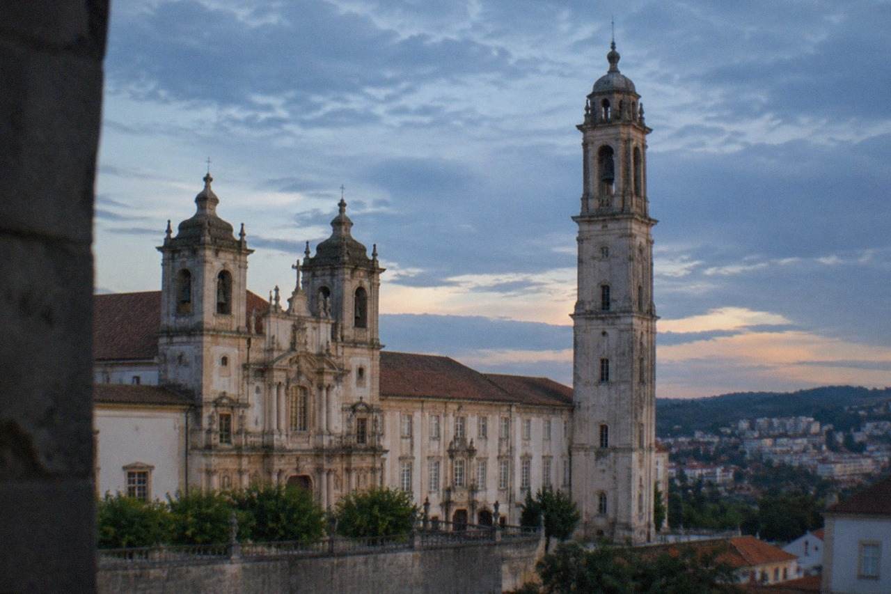Baroque facade of the Mosteiro de Santa Cruz in Coimbra with its bell towers in afternoon light