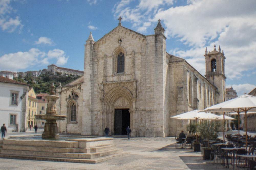 Interior of the Santa Cruz church in Coimbra with gilded baroque altars and stone vaulting