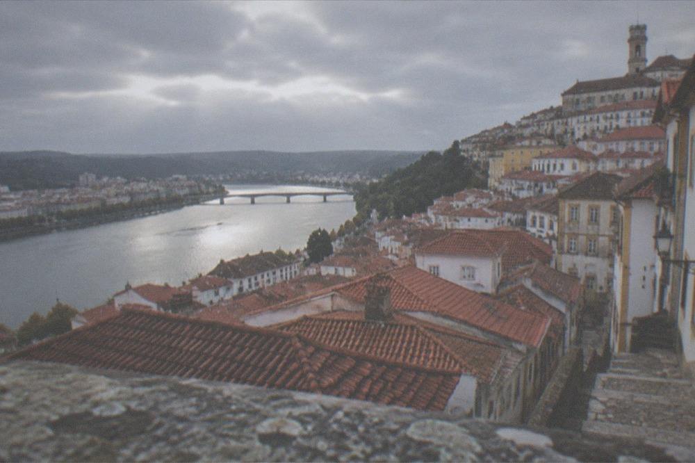 A view over the rooftops of Coimbra toward the River Mondego