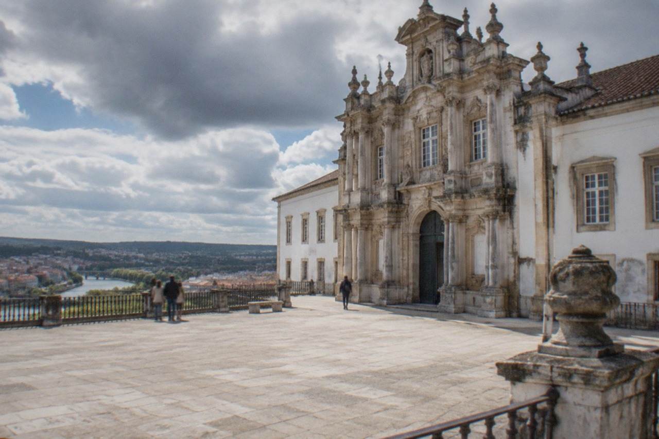 The grand baroque facade of the University of Coimbra's Royal Palace seen from the university hill
