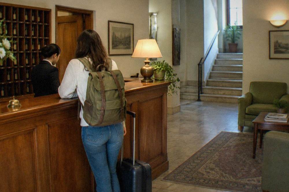 Hotel reception desk in Coimbra with a wooden counter and guest keys
