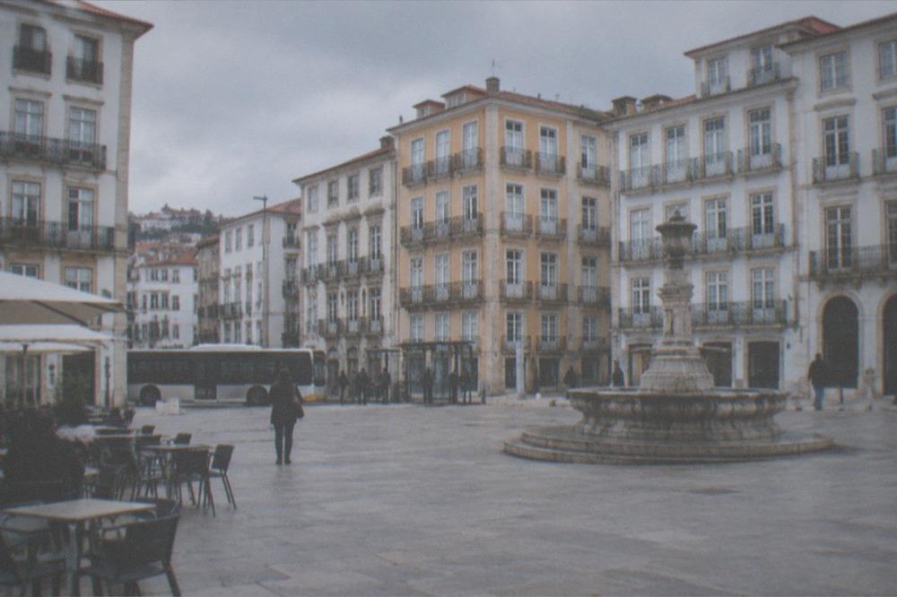A city bus stopped at a street stop in a Portuguese city centre