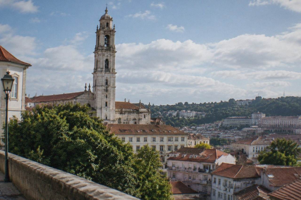 The hillside of Coimbra with the university tower rising above the old town rooftops