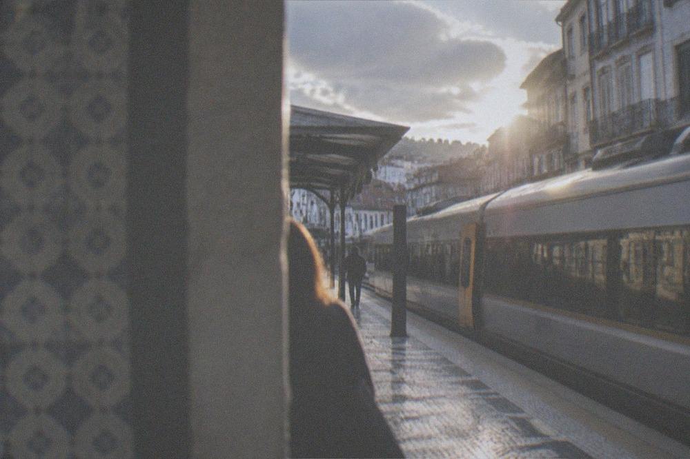 A regional train waiting at a Coimbra platform