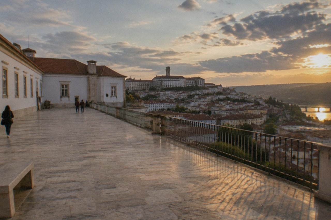 The University of Coimbra buildings on the hill above the River Mondego seen from the city rooftops