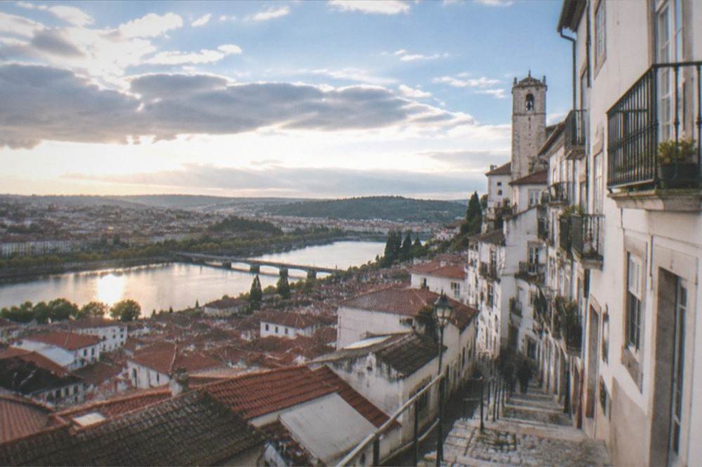 A view over the rooftops of Coimbra from the upper town toward the river below