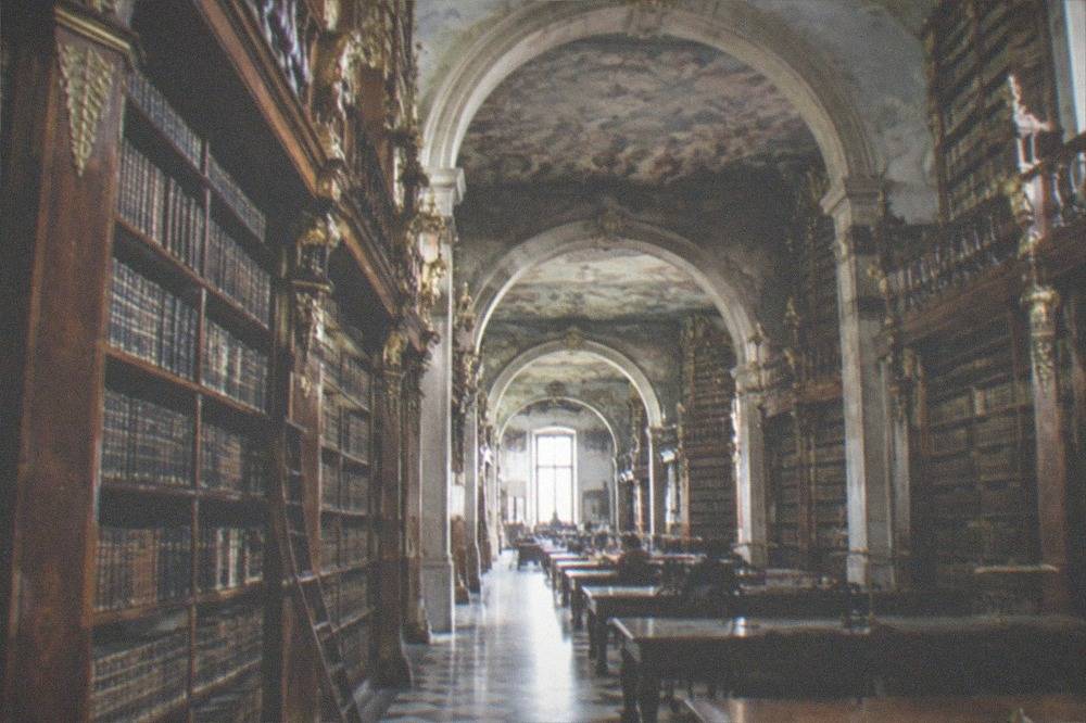 Baroque interior of the Joanina Library with tall wooden bookshelves