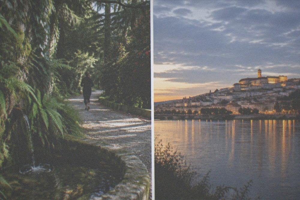 An evening view of lit university buildings on the hill seen from across the River Mondego