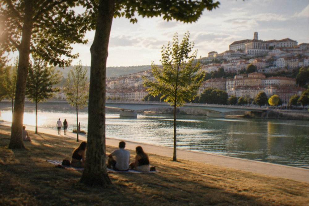 The Mondego river and the old town of Coimbra in warm late afternoon light