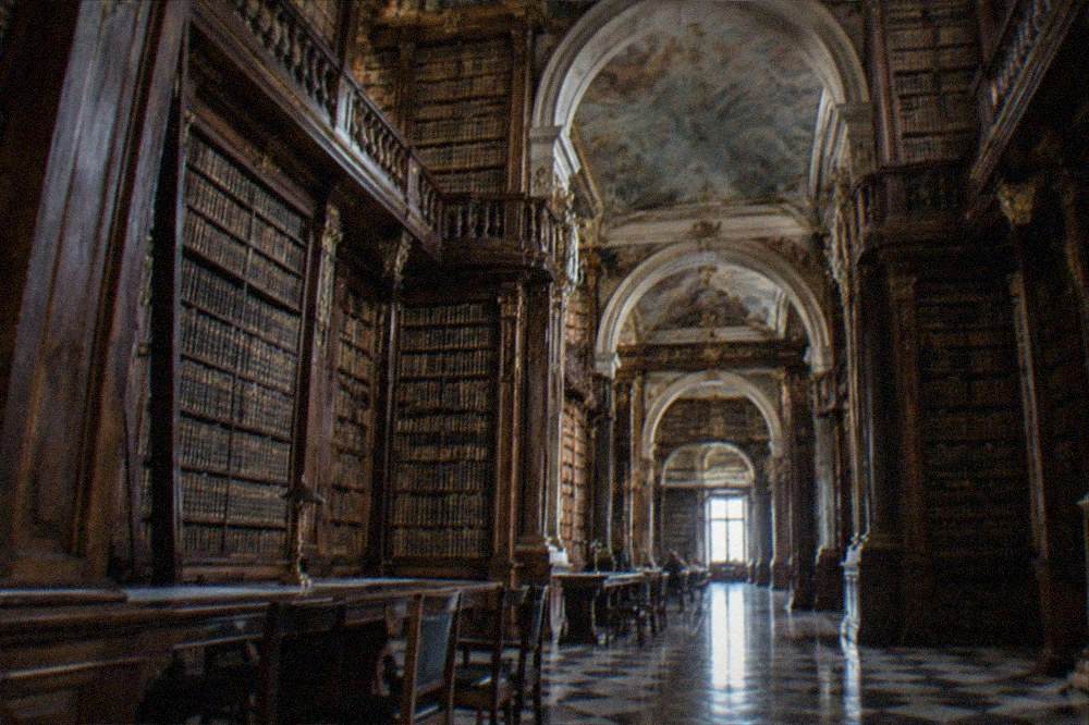The Joanina Library baroque interior with its dark wooden bookshelves