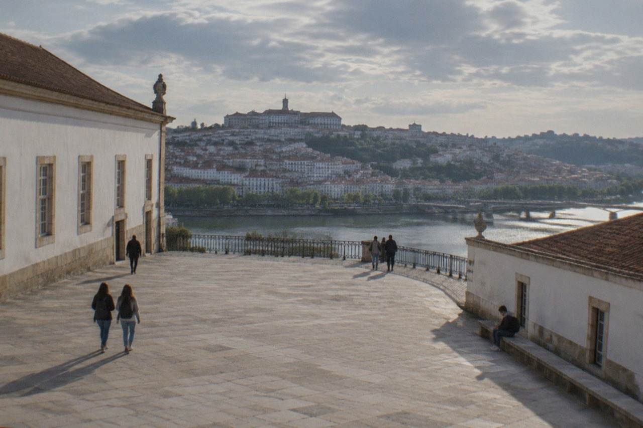 The University of Coimbra buildings and the old town seen from across the River Mondego