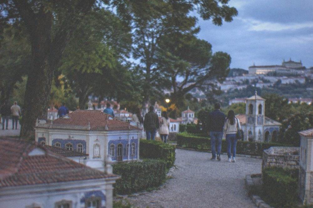 Families walking among the miniature buildings of Portugal dos Pequenitos