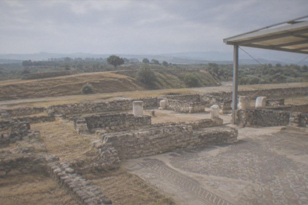 The Roman house foundations and column fragments at the Conímbriga archaeological site