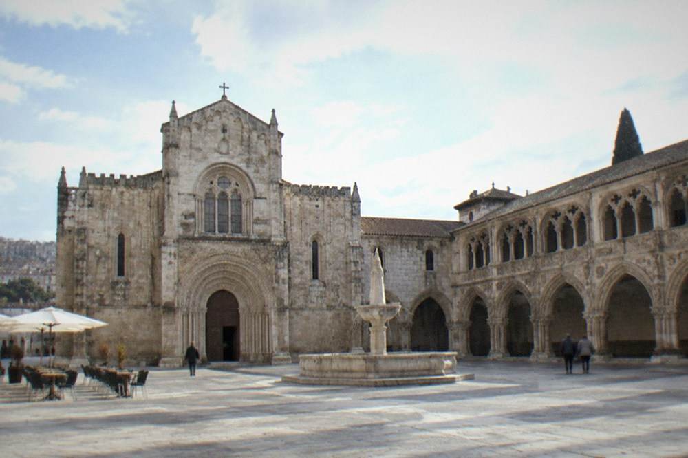 The cloister of the Monastery of Santa Cruz with carved stone arches
